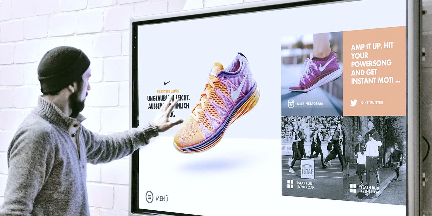 Platzhalter: Interaktiver Touchscreen im Store mit Kachelraster und Live-Community-Feed.