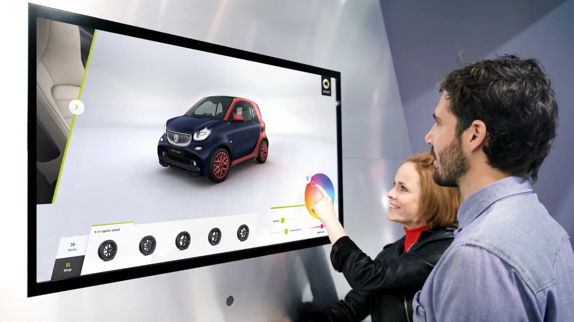 Touchscreen showroom at the IAA with a visitor using the 3D configurator.